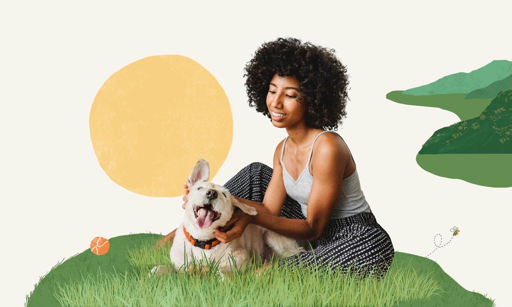 A woman petting a dog on the grass.