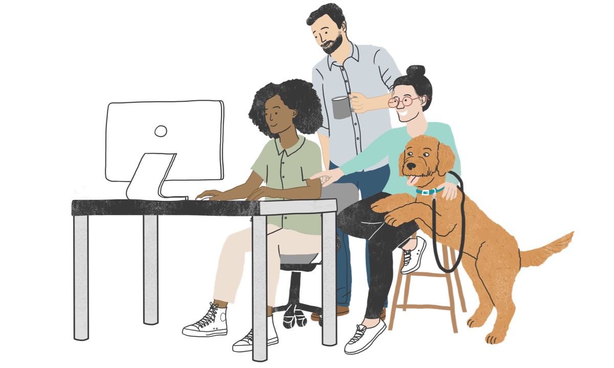 Office workers and dog gathering around a computer monitor