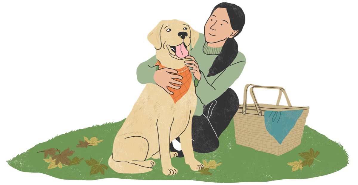 Woman having picnic with dog