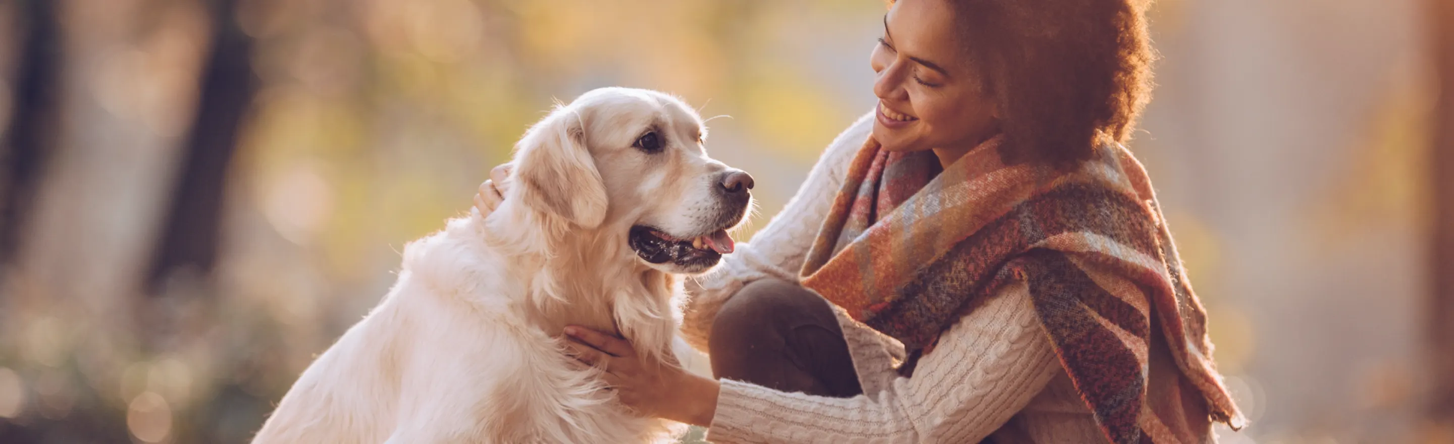 woman smiling at dog