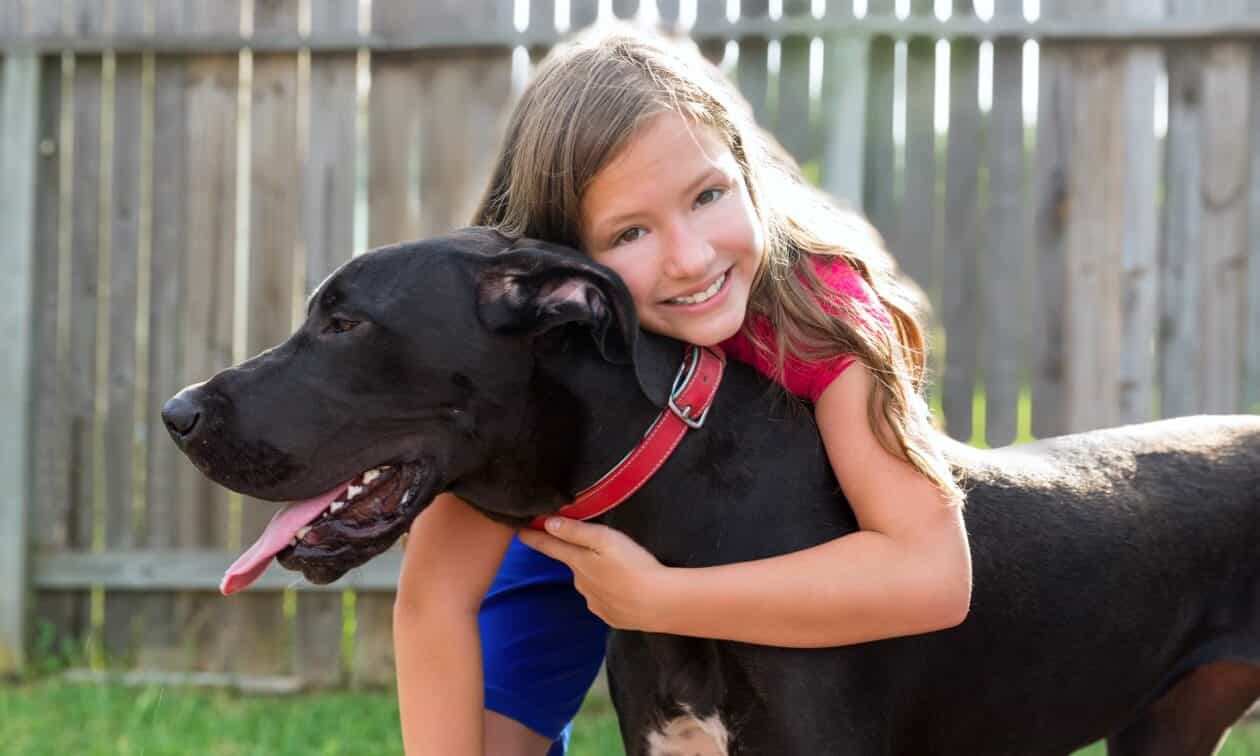 Girl hugging dog