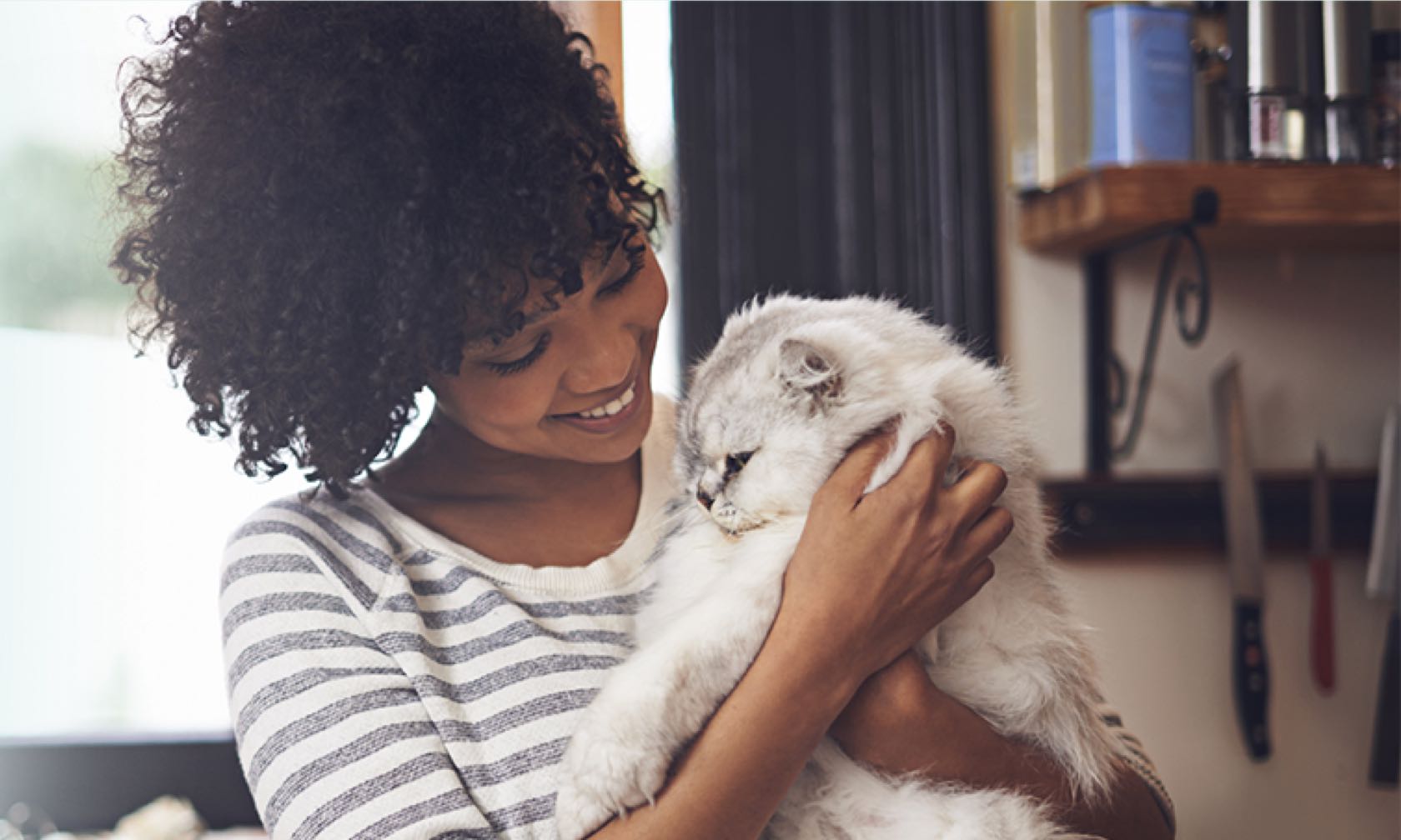 Woman hugging cat