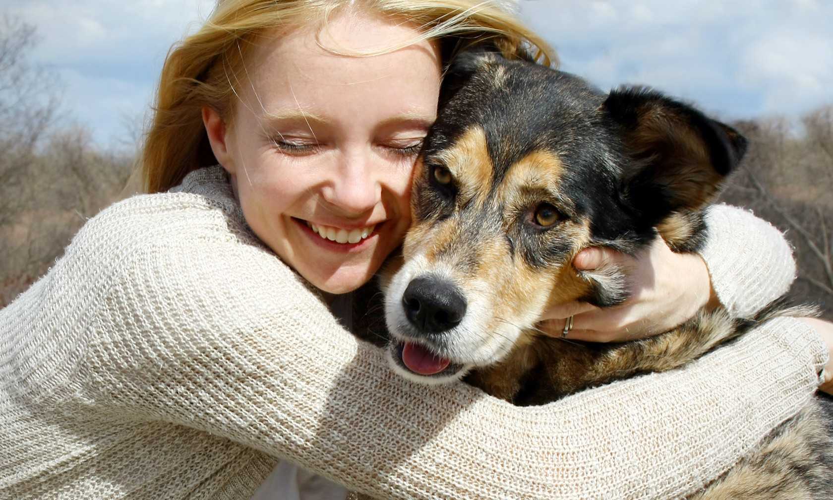 Woman hugging her dog