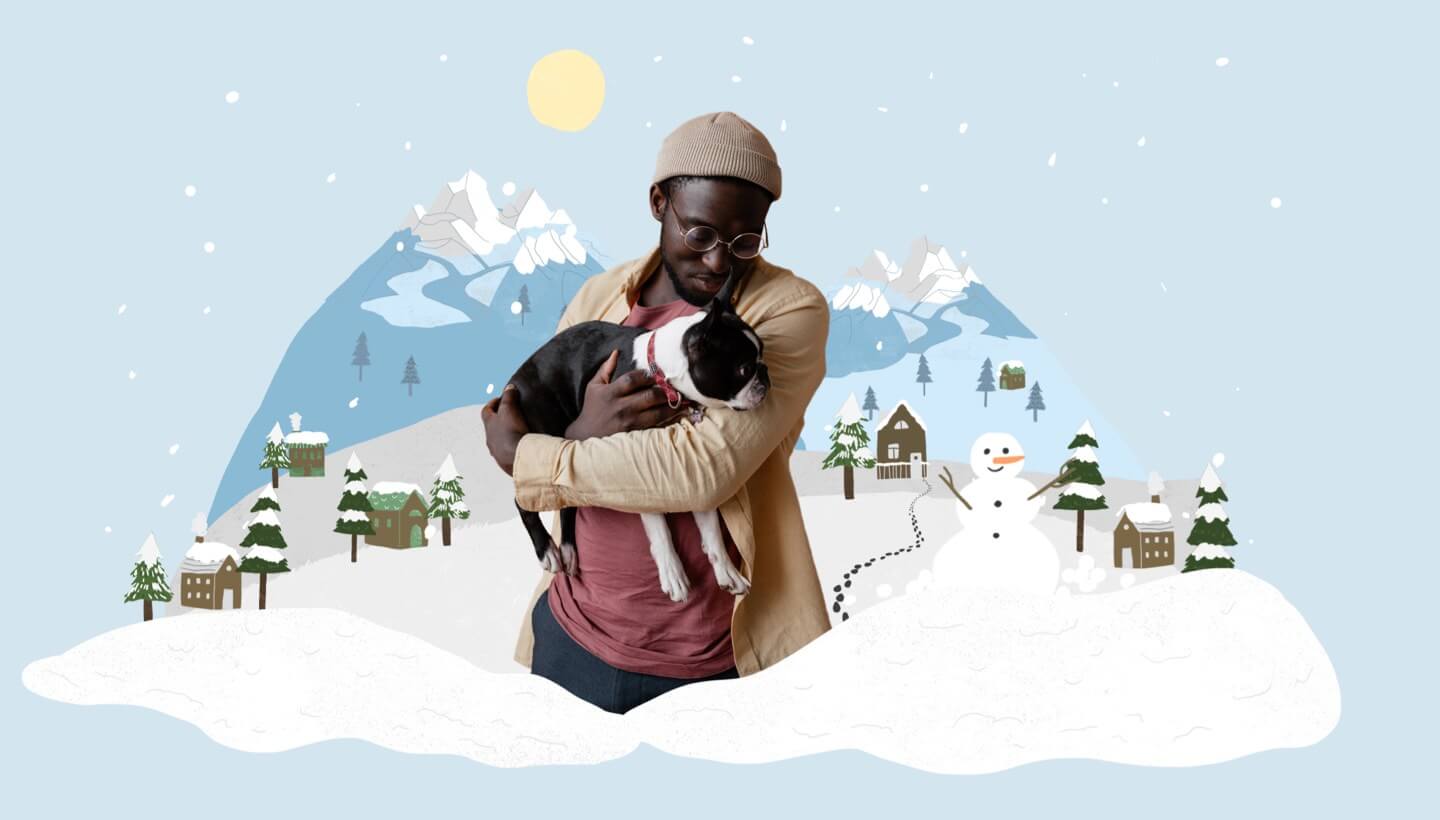 Man carrying dog in winter.