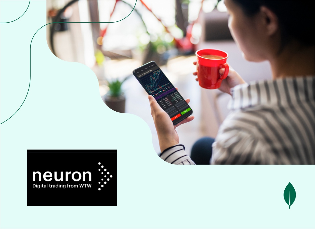 Young woman checking a trading dashboard on her smartphone while holding a cup of coffee.