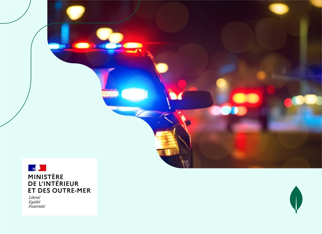 A photo of a police car with flashing lights on.