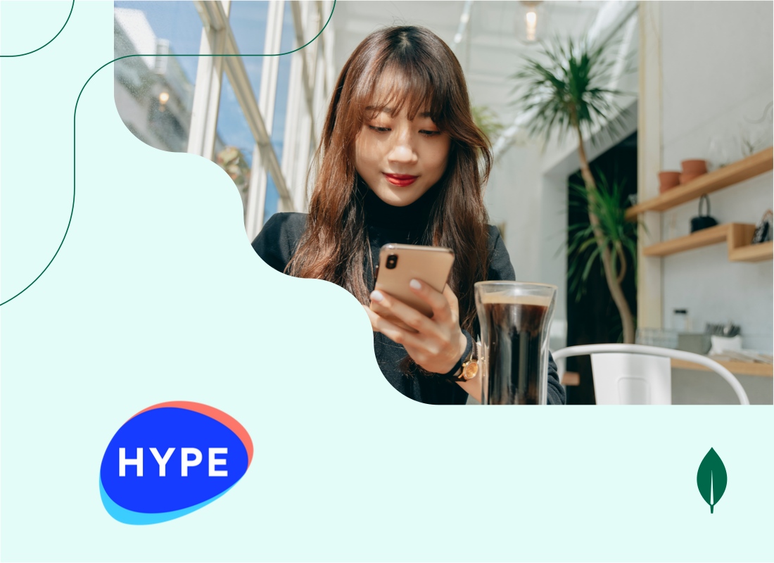 Young woman looking at her smartphone with a cup of black coffee on the table beside her.