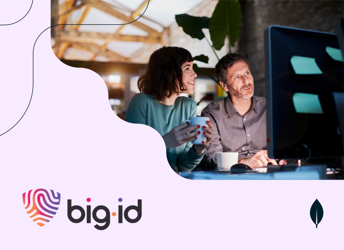 Two professionals viewing a computer monitor and having a discussion.