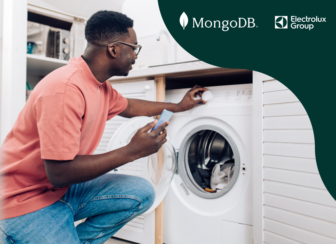 Photo of a man near a washing machine.