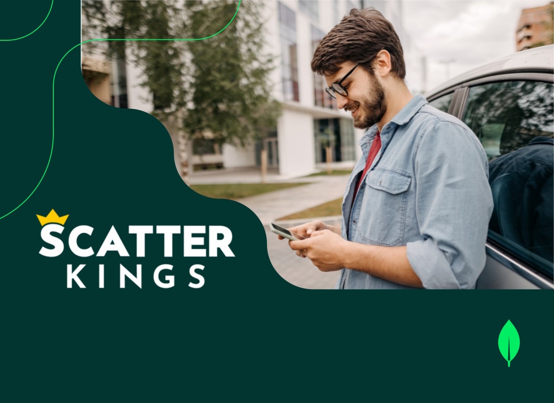 Photo of a man typing on his phone.