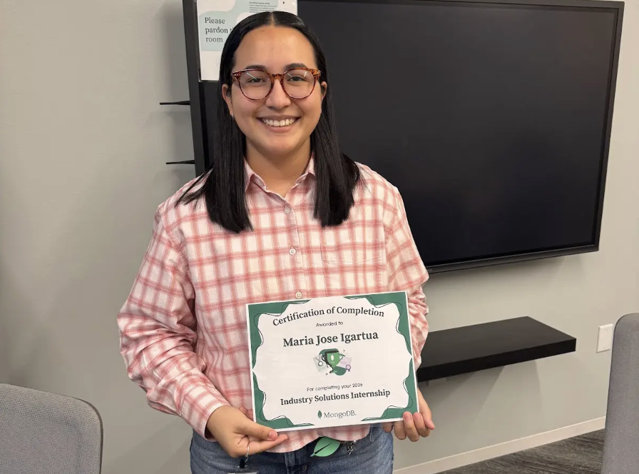 Photo of Maria with her certificate.