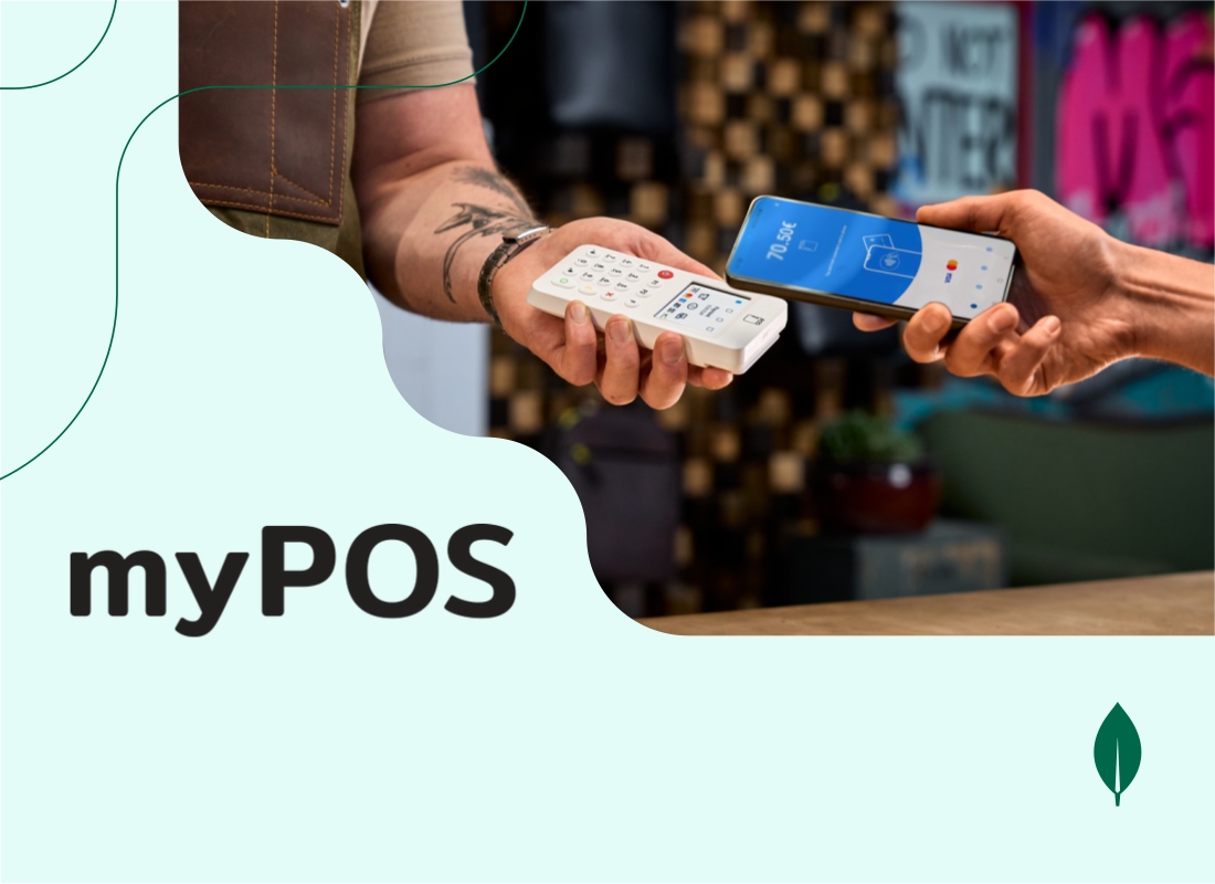 A person using a mobile phone with a card machine to complete a payment.