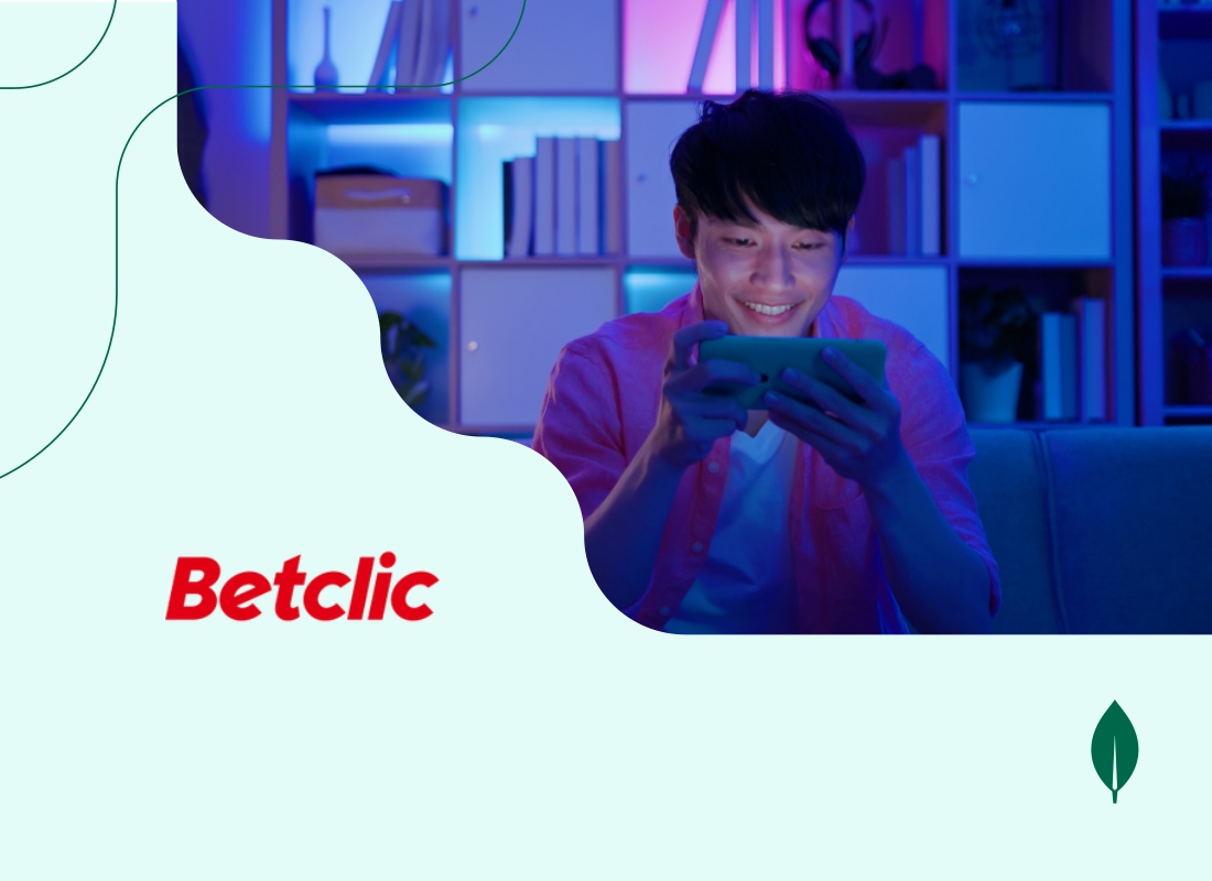 A photo of a man playing on his smartphone.