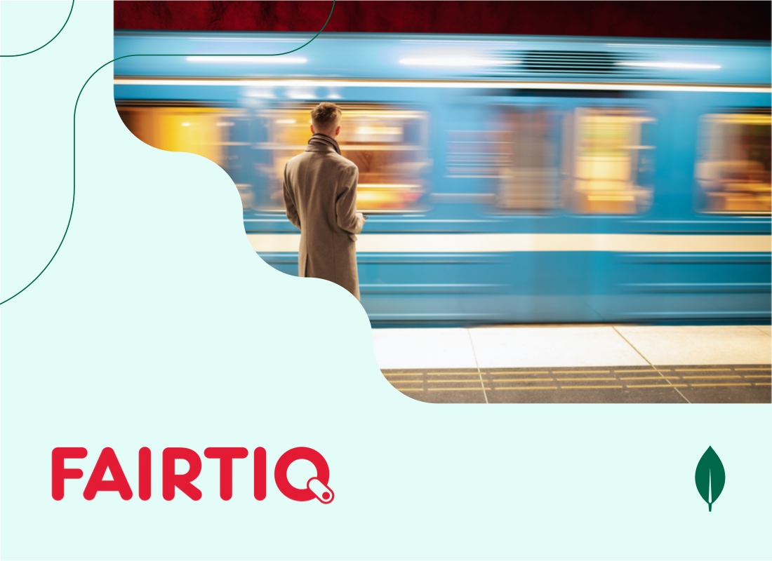 A photo of a man at a railway station.