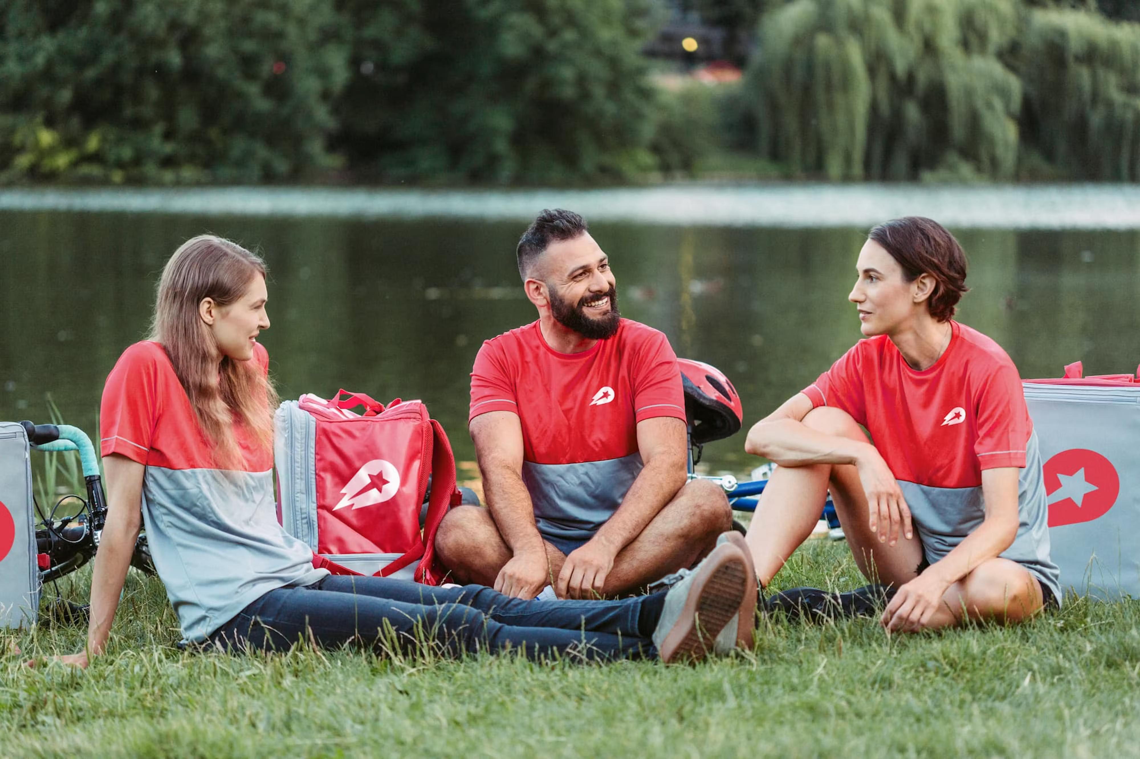 Illustration of company employees relaxing in nature near a river