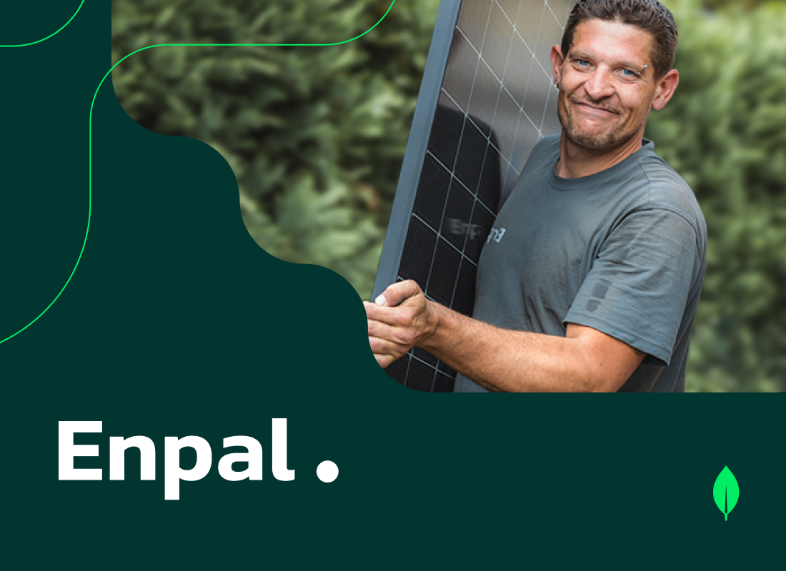 A person transporting a solar panel.