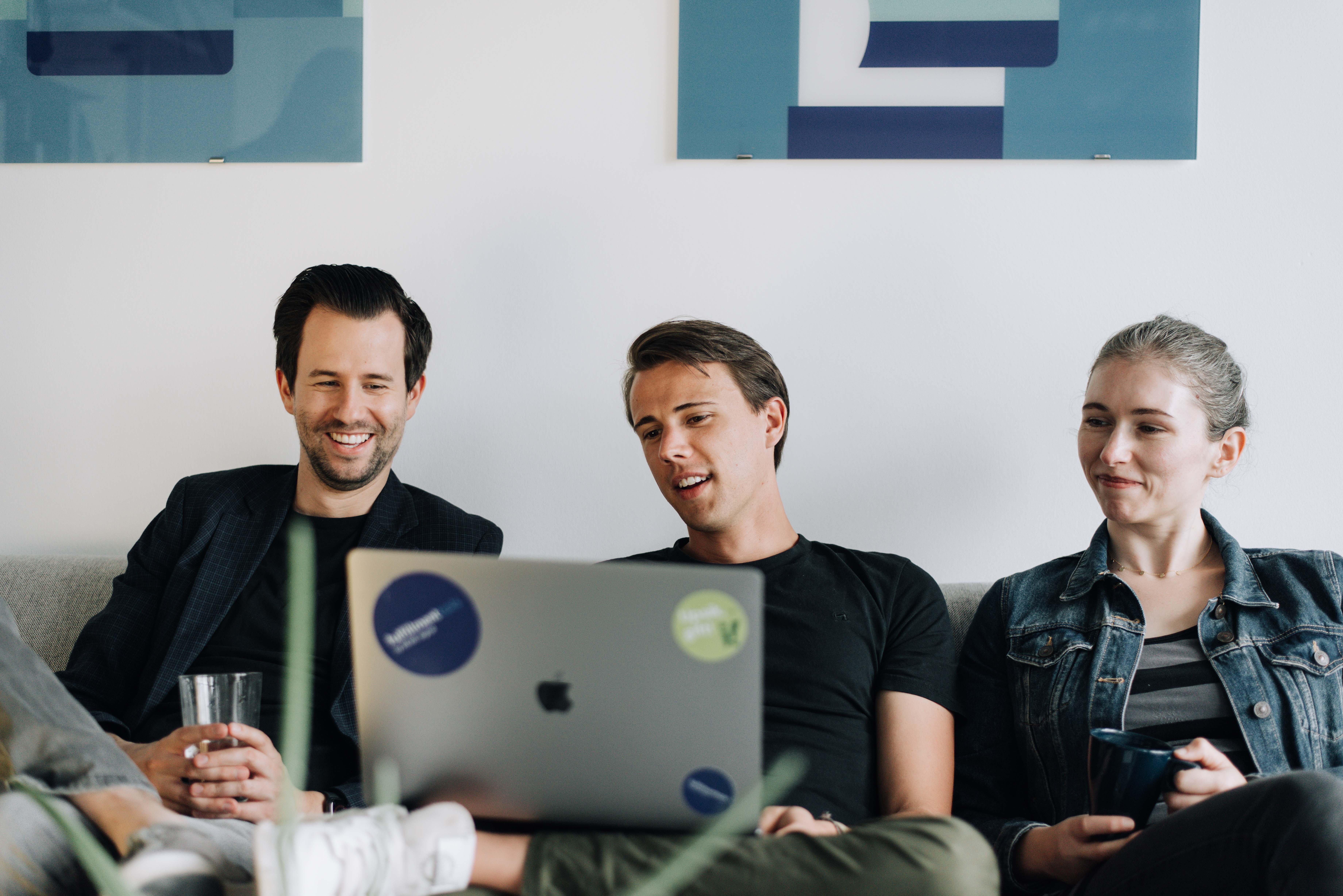 a group of people spending time on a laptop