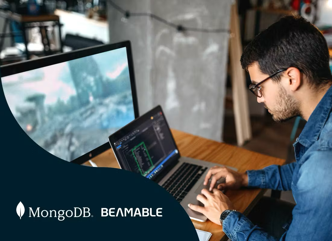 Image of a man working on a laptop.