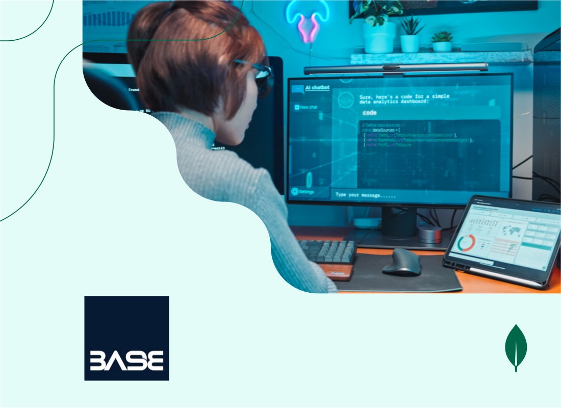 A person working on a desktop computer with code displayed on the screen.