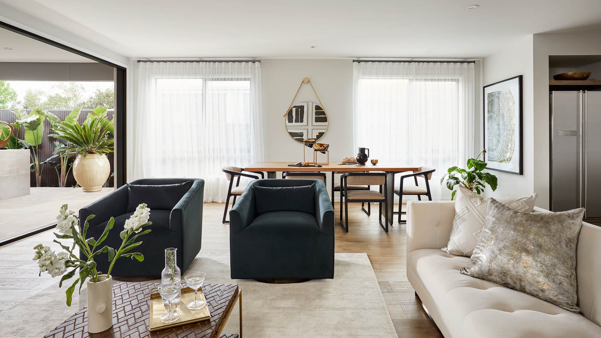 Monaco 28 living area with lots of natural light featuring sheer curtains