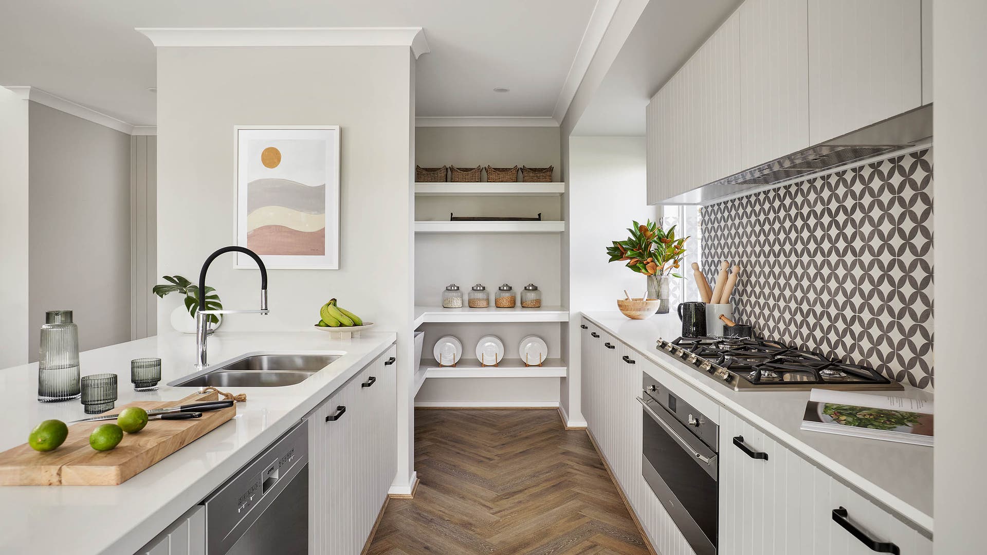Modern kitchen area with a butler's pantry, styled with minimalist design features.