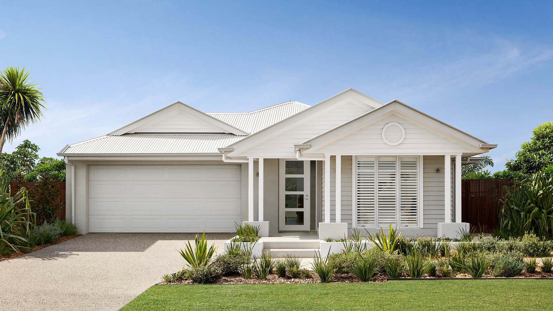 Single storey house with neutral warm toned coloured facade.