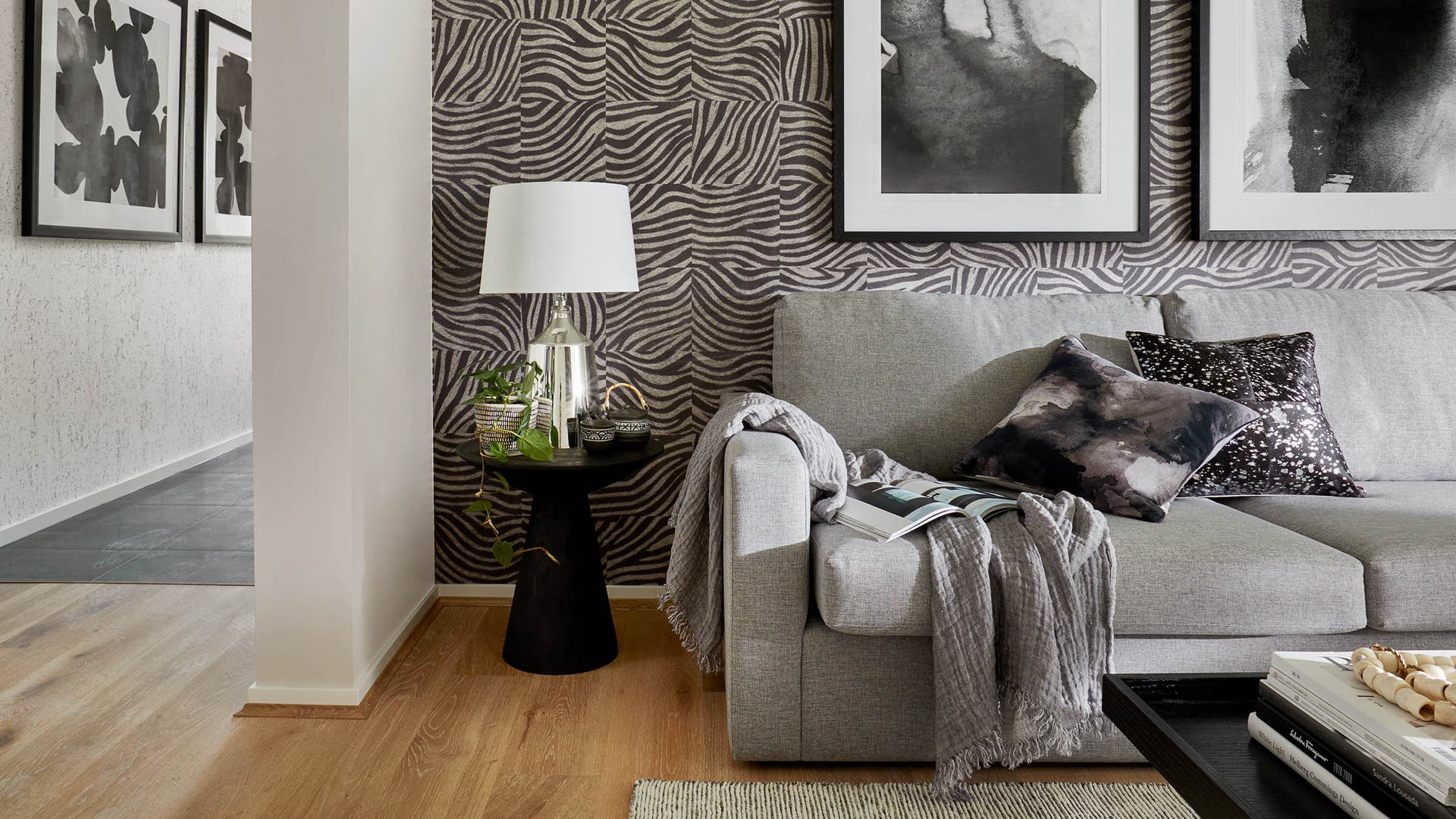 A leisure room featuring animal-print wallpaper and a modern grey-toned colour scheme, enhanced with contemporary design elements.