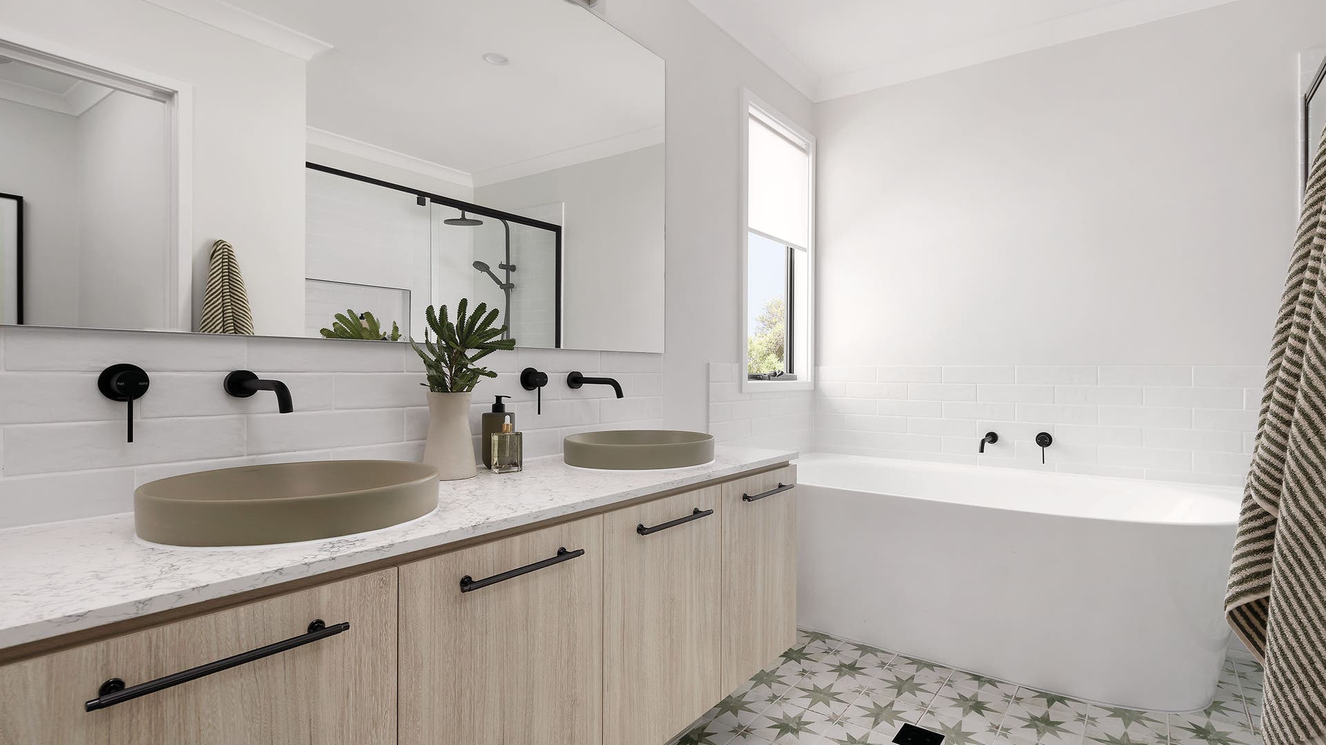 Neutral toned modern bathroom with pattern tiles and Zenith bench