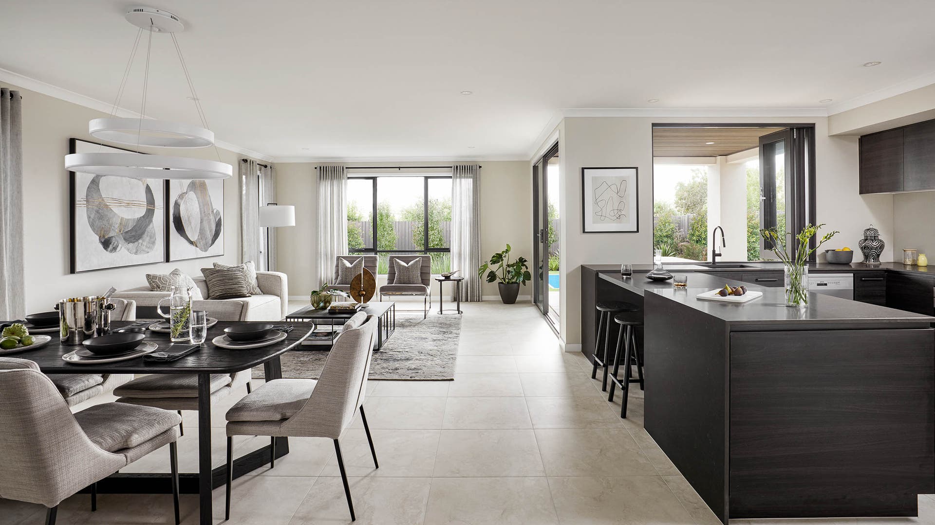 Ashbury 30 on display in Cranbourne - showcasing the kitchen, living and dining spaces all blending seamlessly with a convinenet servery window in the kitchen.