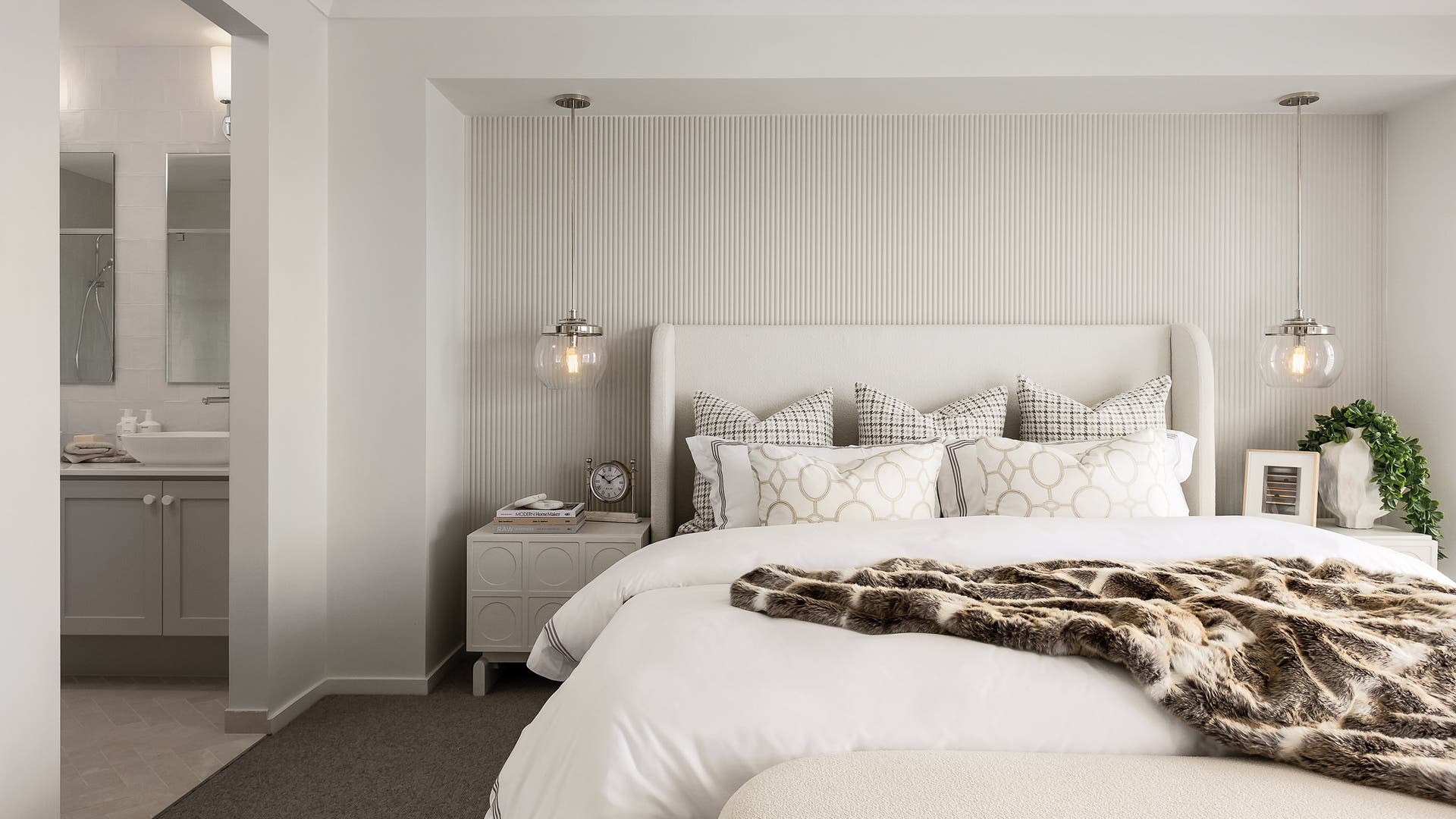 A master bedroom with Hamptons styling and decorations.