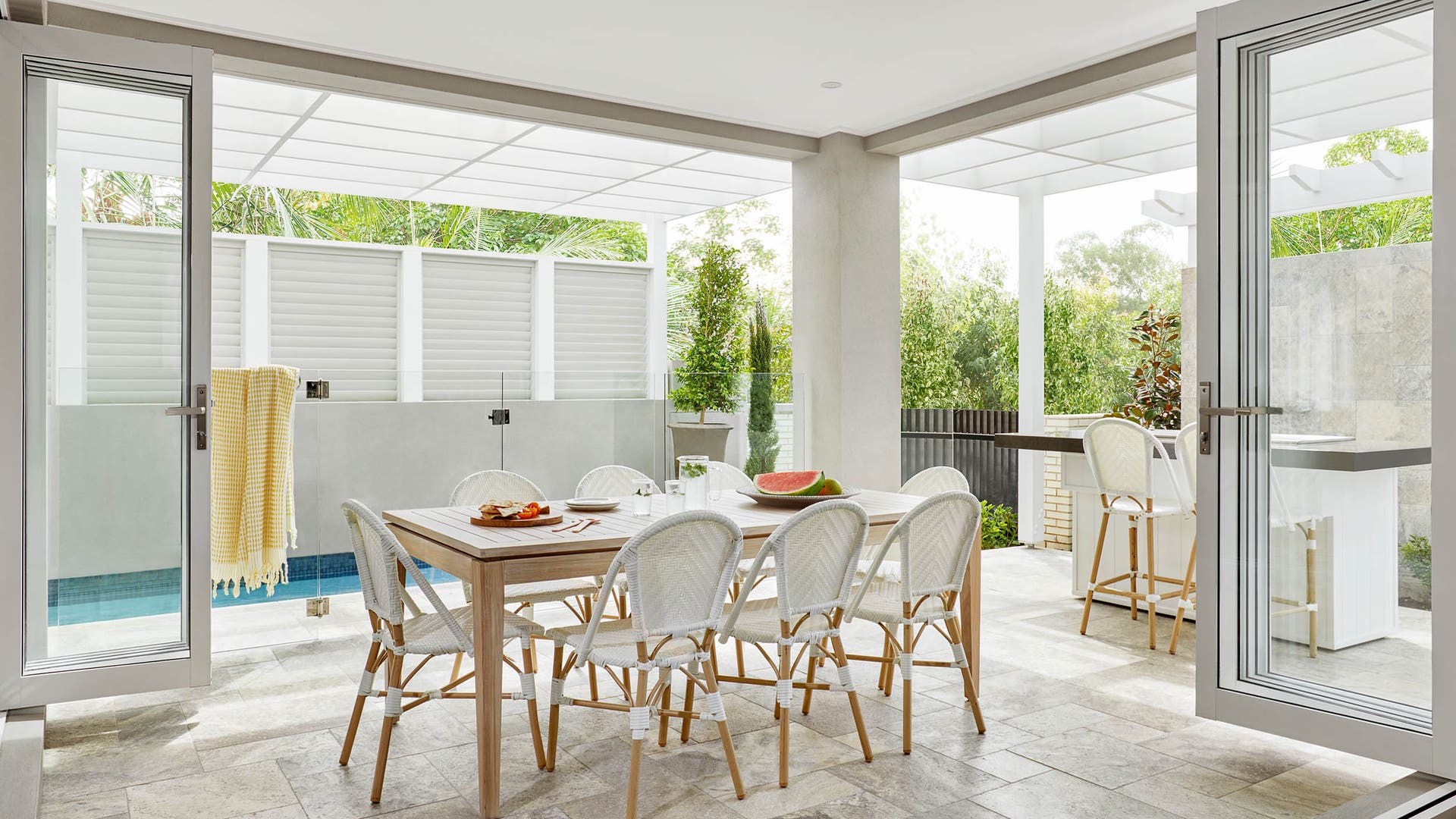 Modern spacious alfresco with kitchen and dining area and a complete pool zone.