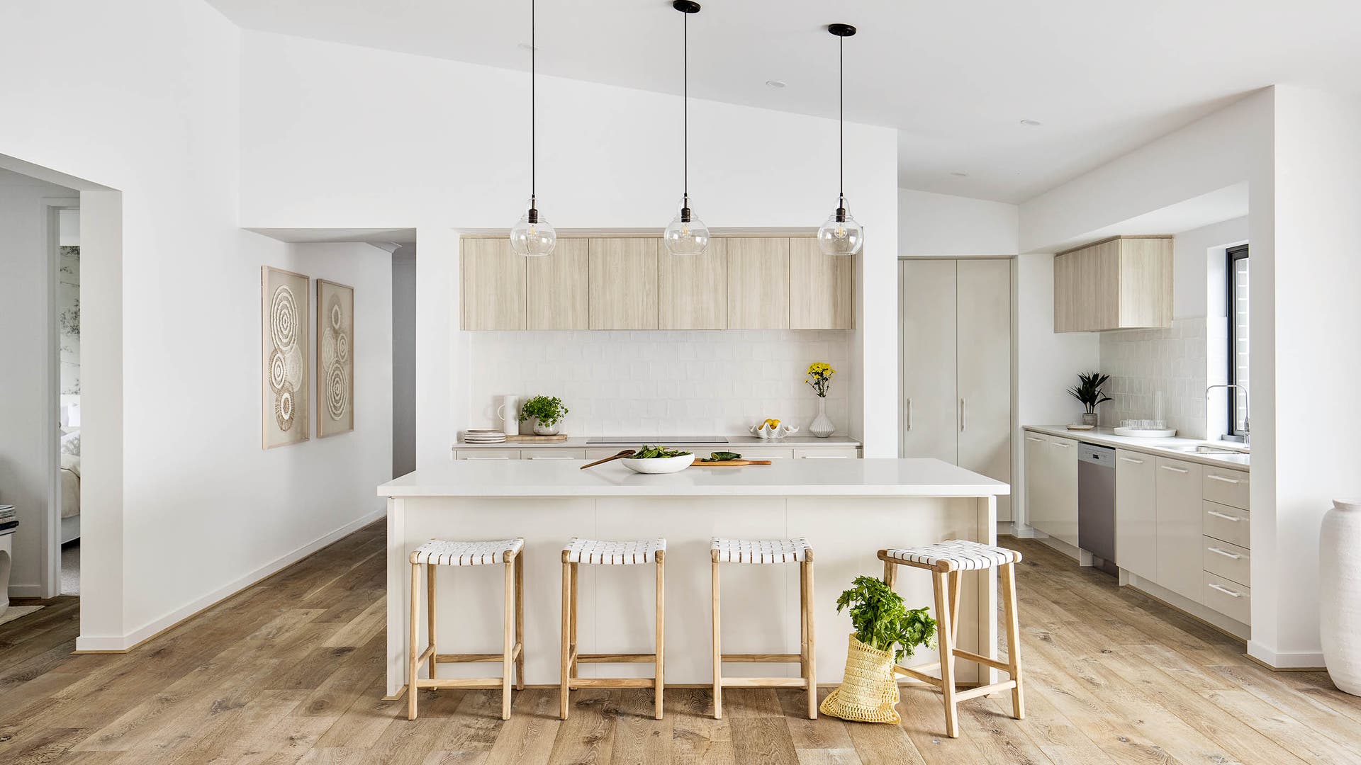 Vienna 28 Kitchen on display in Donnybrook. Featuring a crisp coastal colour pallette with feature pendant lighting above the grand island bench.