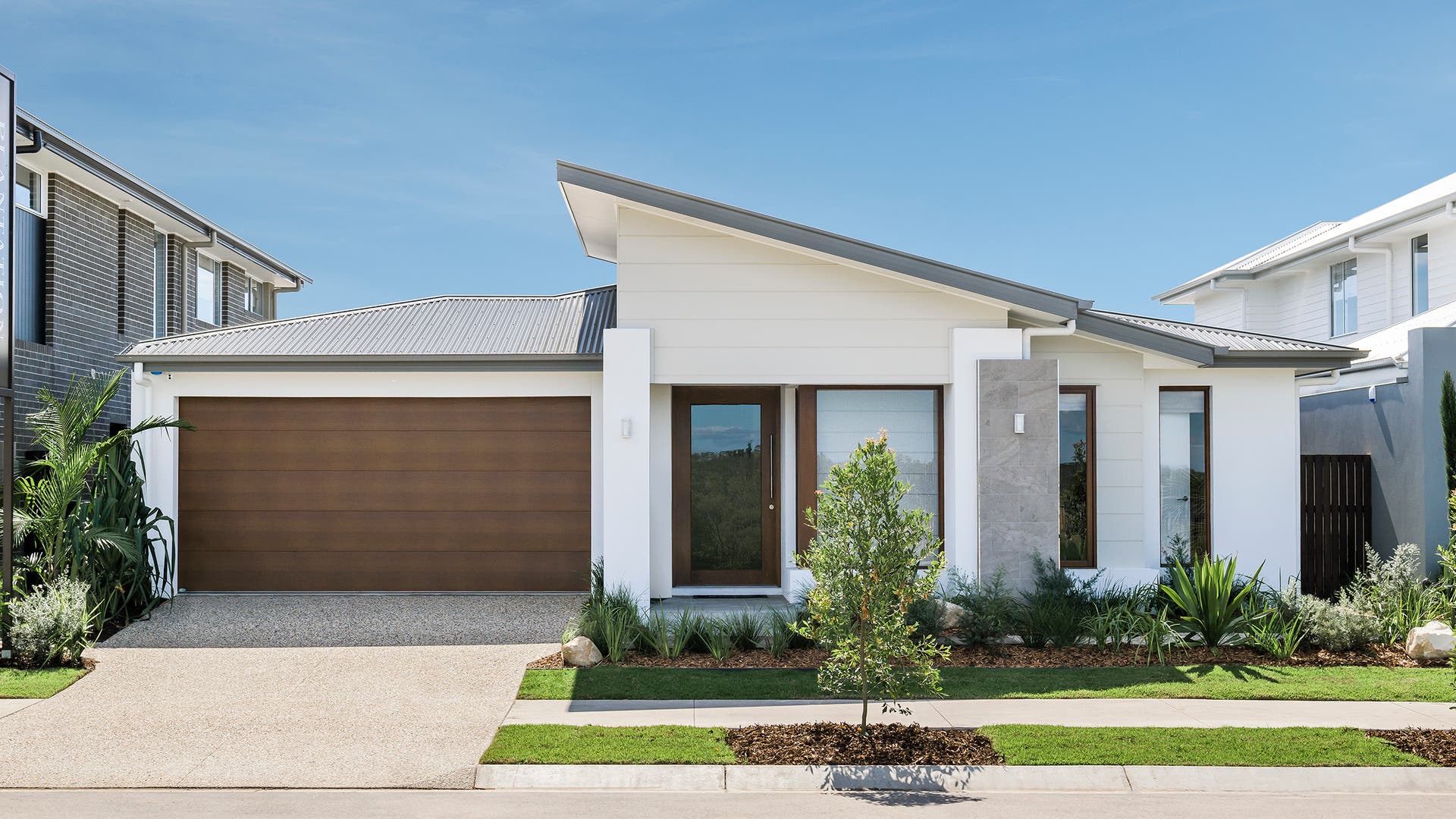 Single storey home with an asymmetrical modern facade design.