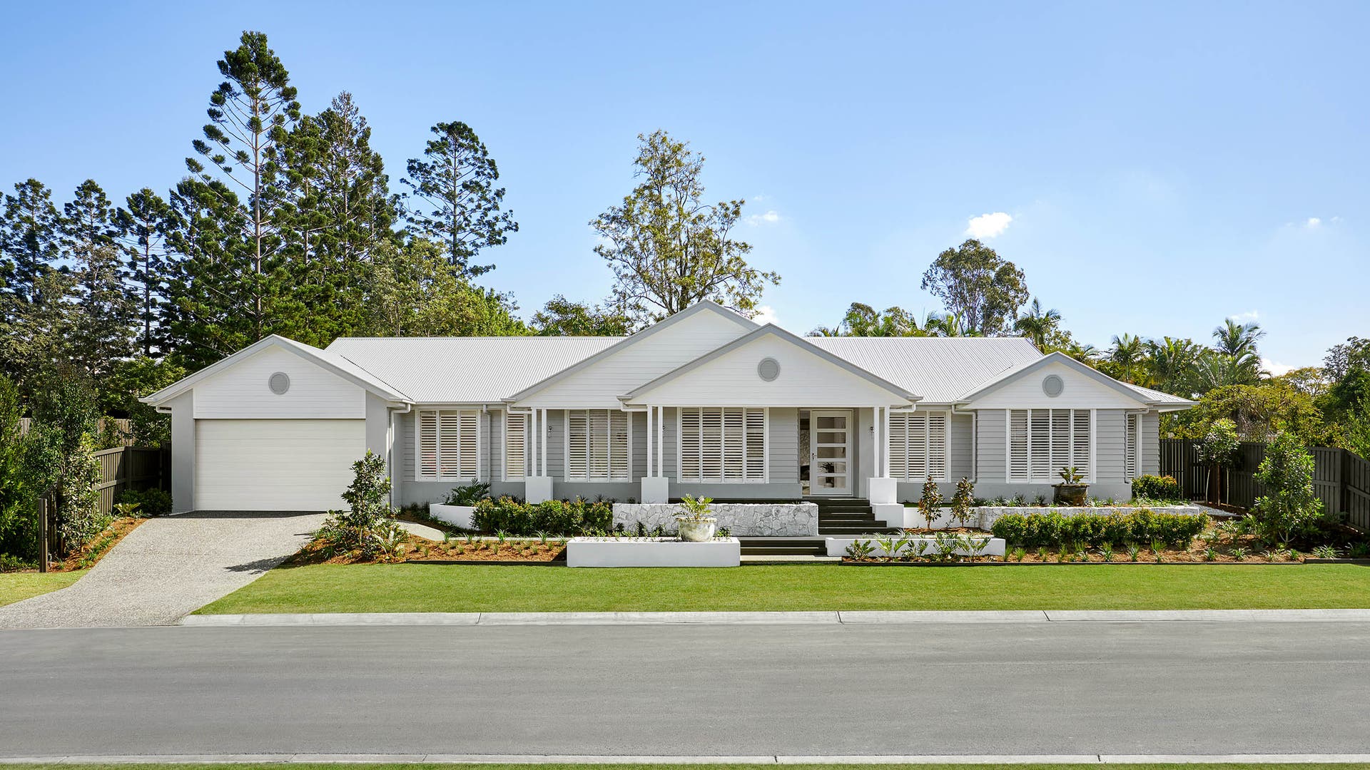 Plantation Acreage Colorado-style home with cool grey neutral tones and a fully finished landscape