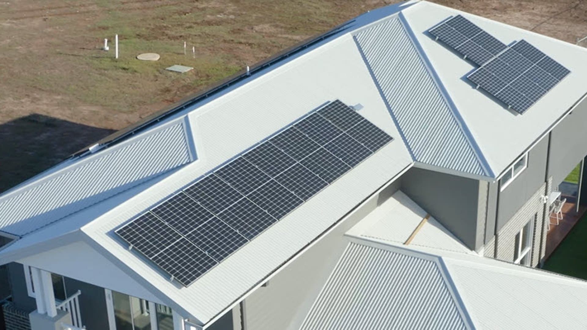 Plantation Homes with a solar panel roof.