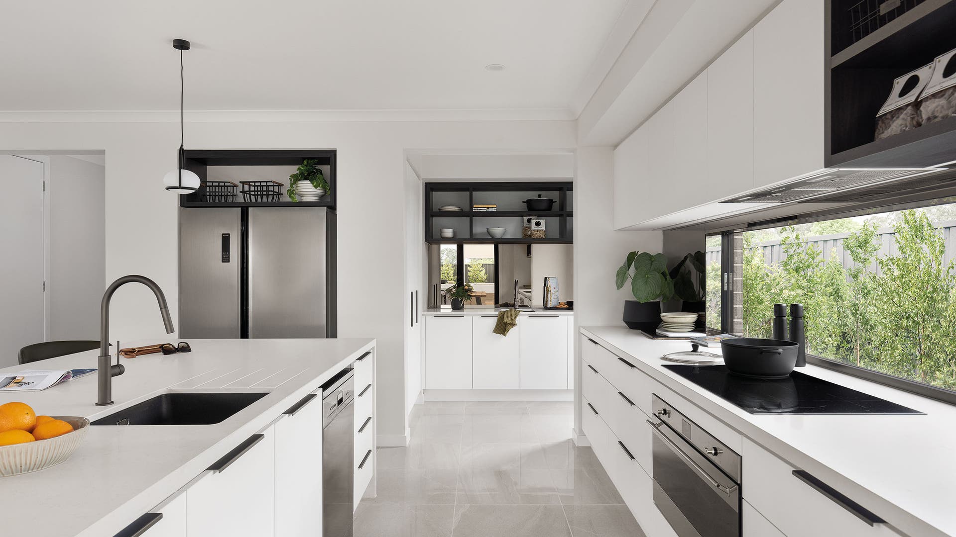 An all-white kitchen design is available from Henley Homes. This is the Airlie 41 on display in Kalkallo.