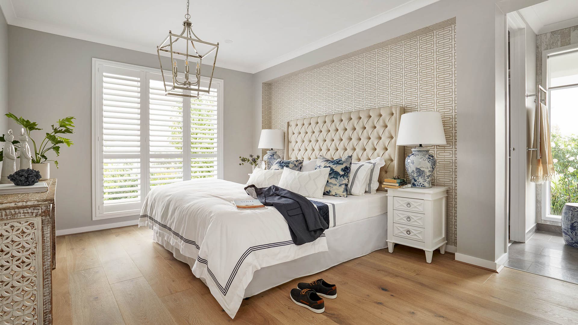 Carmelle 28 master bedroom on display in Berwick featuring white shutters on the windows