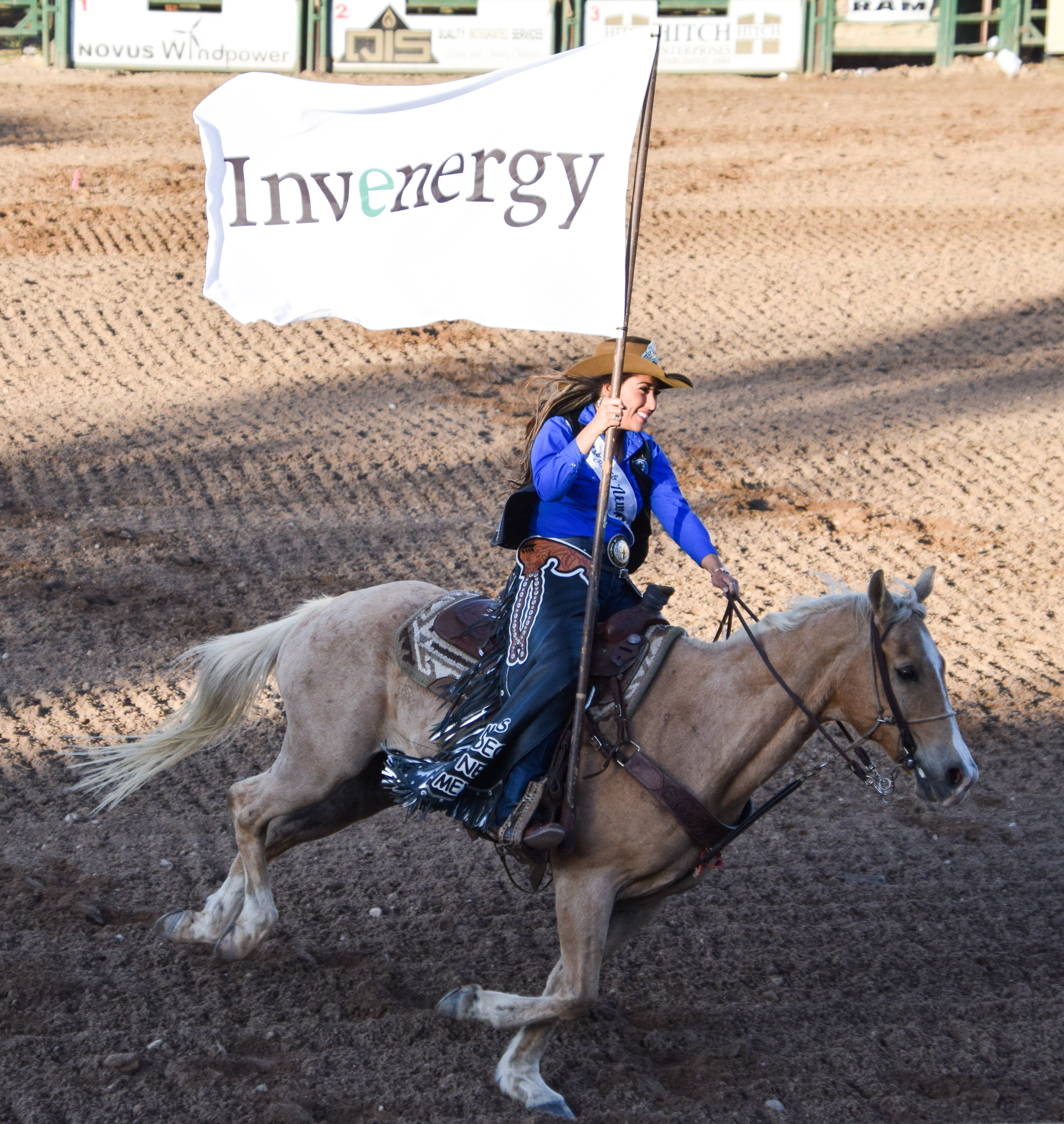 Rodeo-Queen-carrying-the-Invenergy-sponsor-flag.jpg