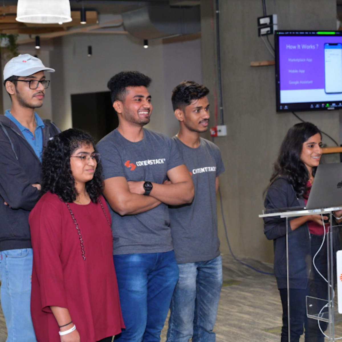 Image showing three men and two women on a winning team at a recent Contentstack Hackathon.