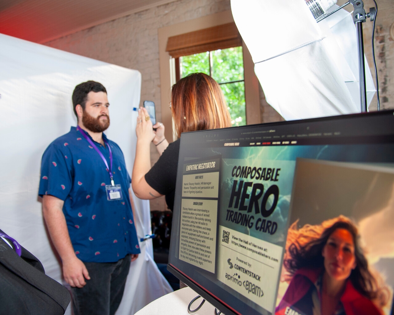 A team member snaps a photo of an SXSW attendee for his Composable Hero trading card.