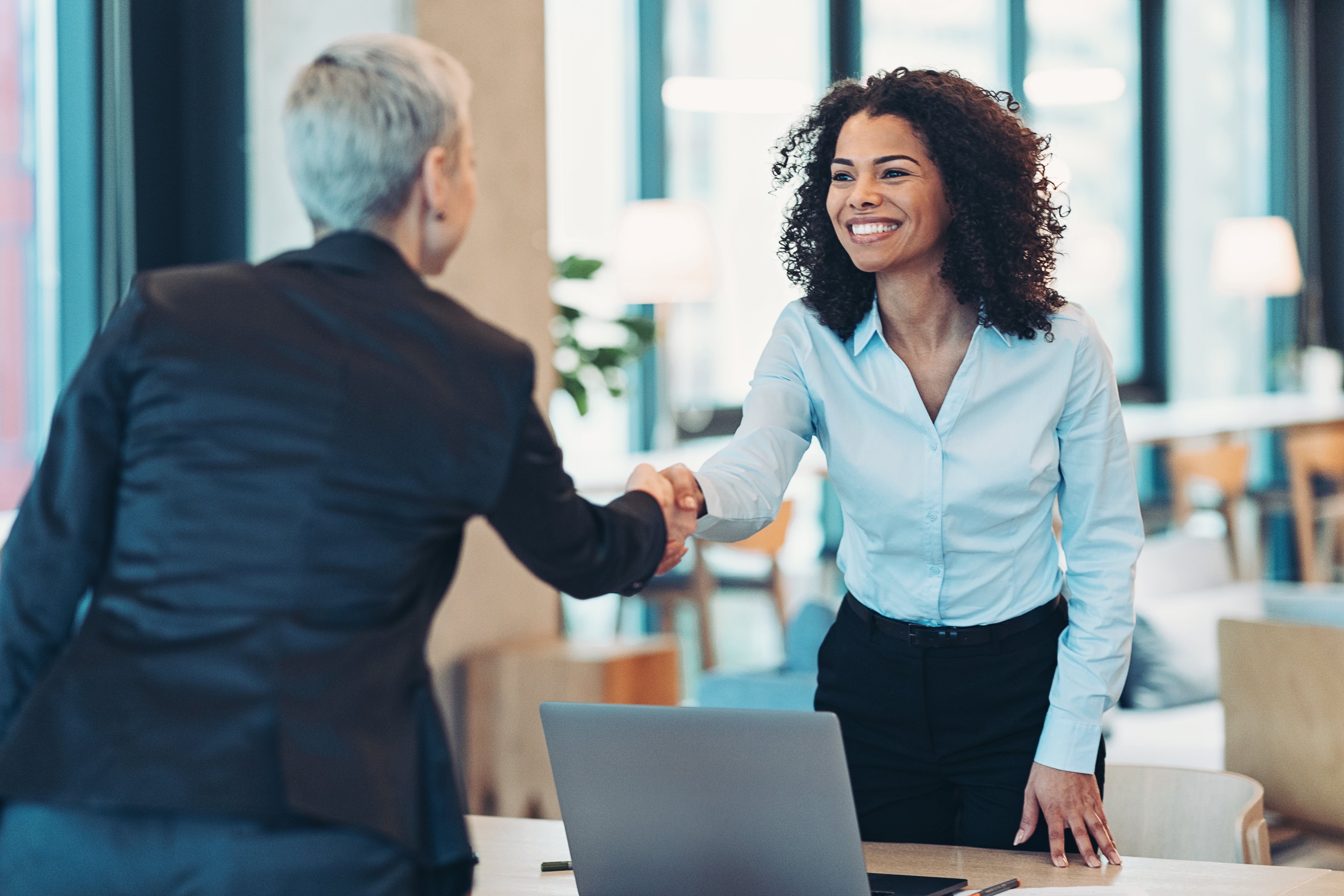 women shaking hands
