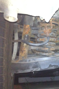 A before photo of my rear suspension and brake line. The entire brake system was dead weight.