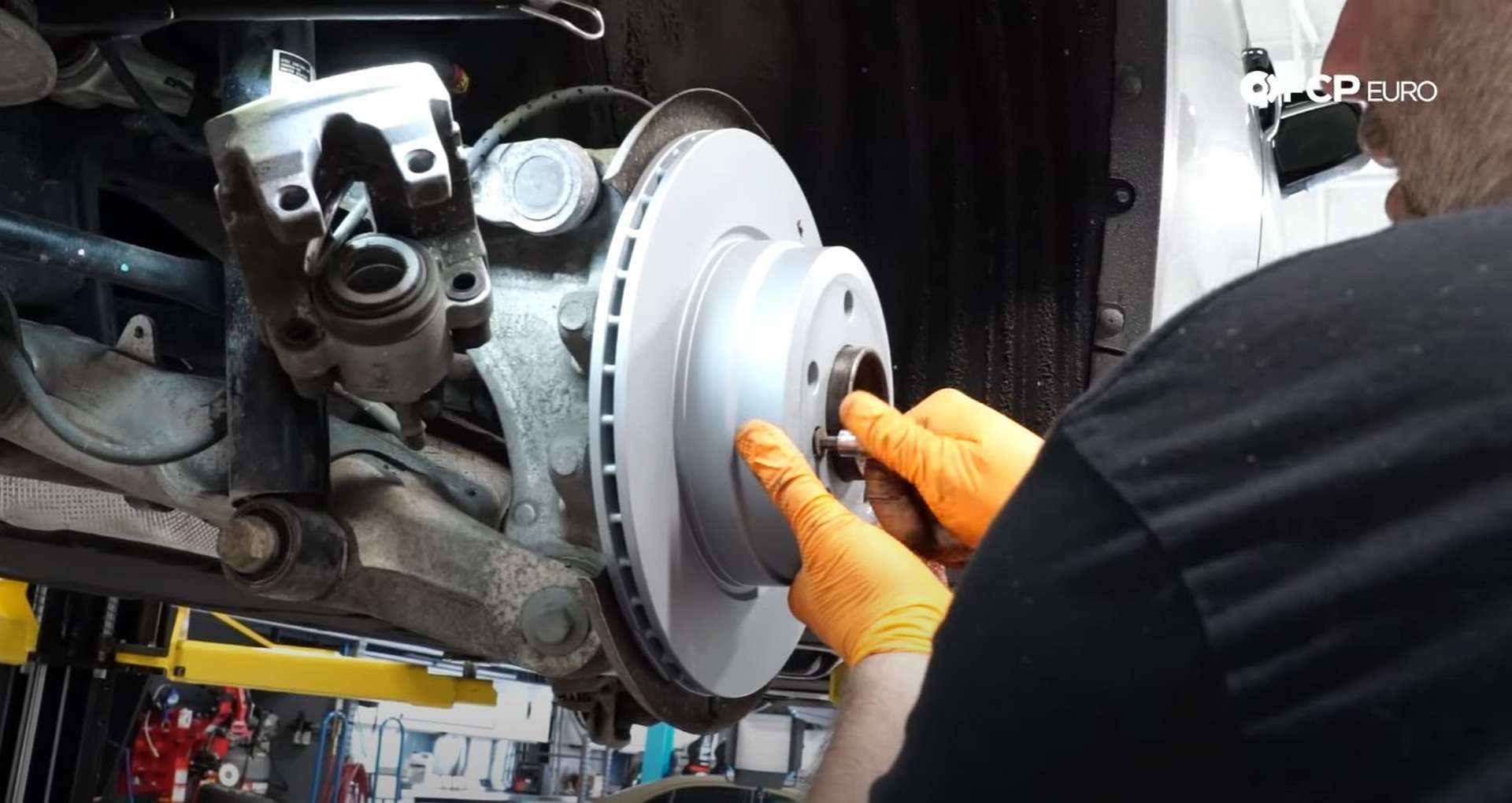 DIY BMW F15 X5 F16 X6 Brake Service securing the new rear rotor