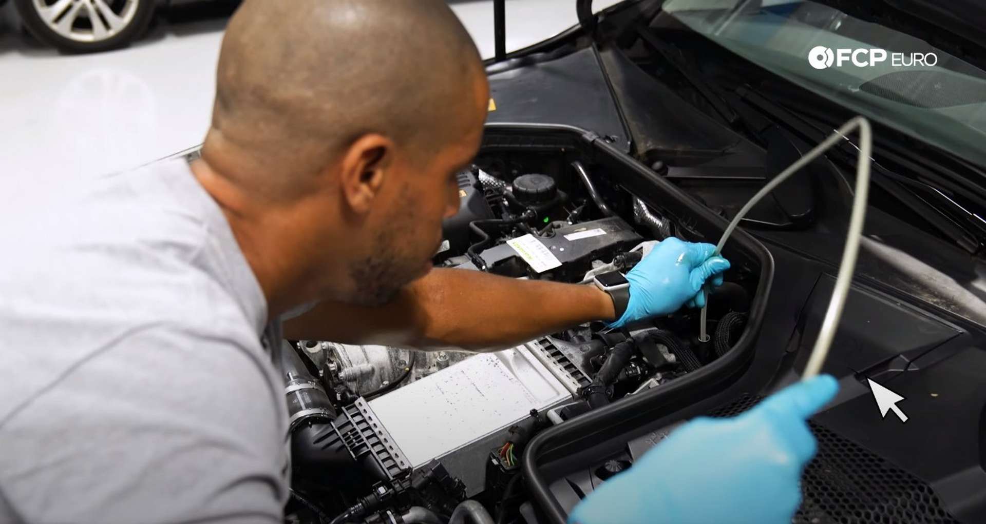 DIY Mercedes M274 Oil Change feeding fluid extraction tube into the dipstick tube