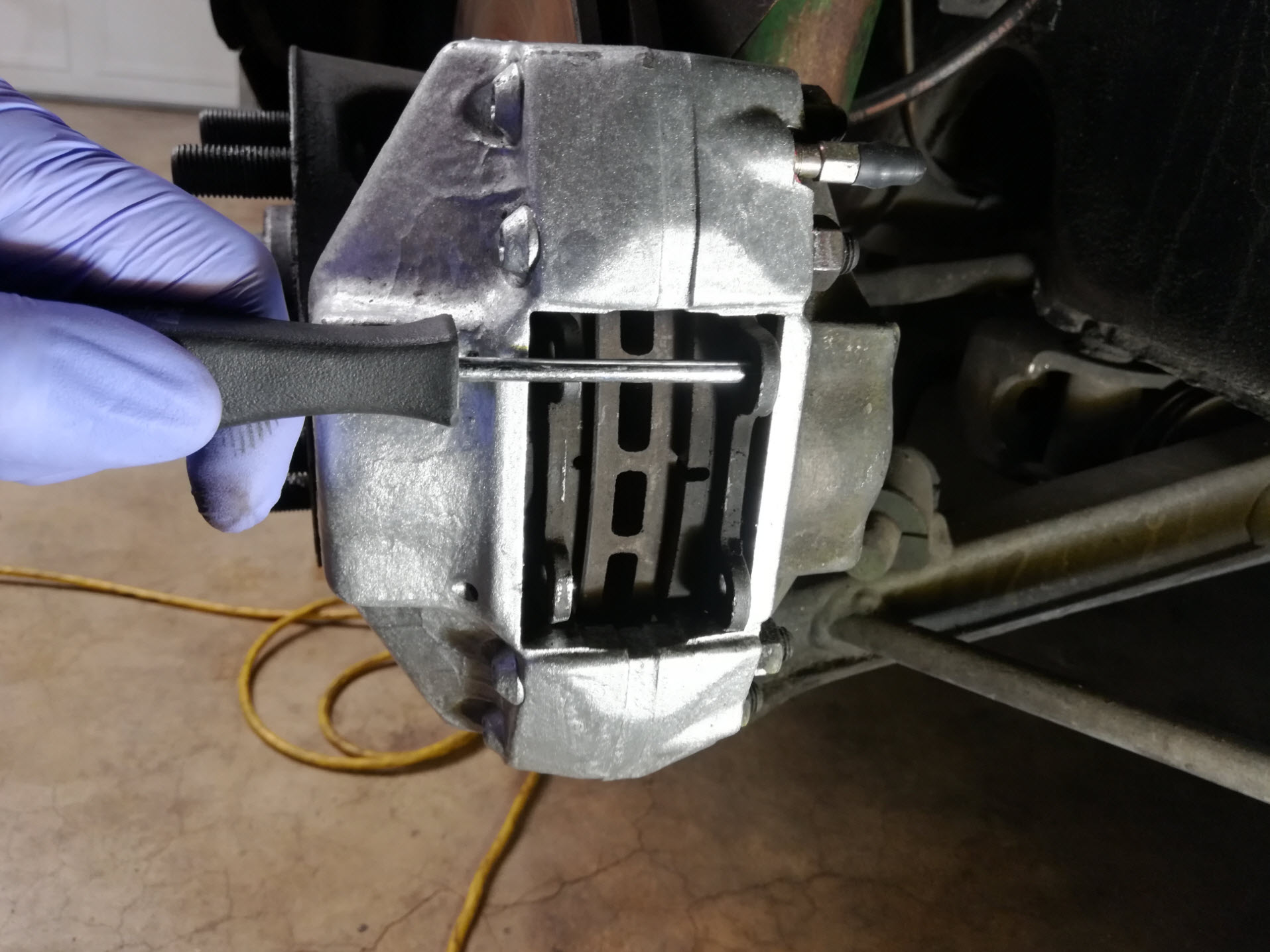 Air-cooled Porsche 911 brake pad removal tip.