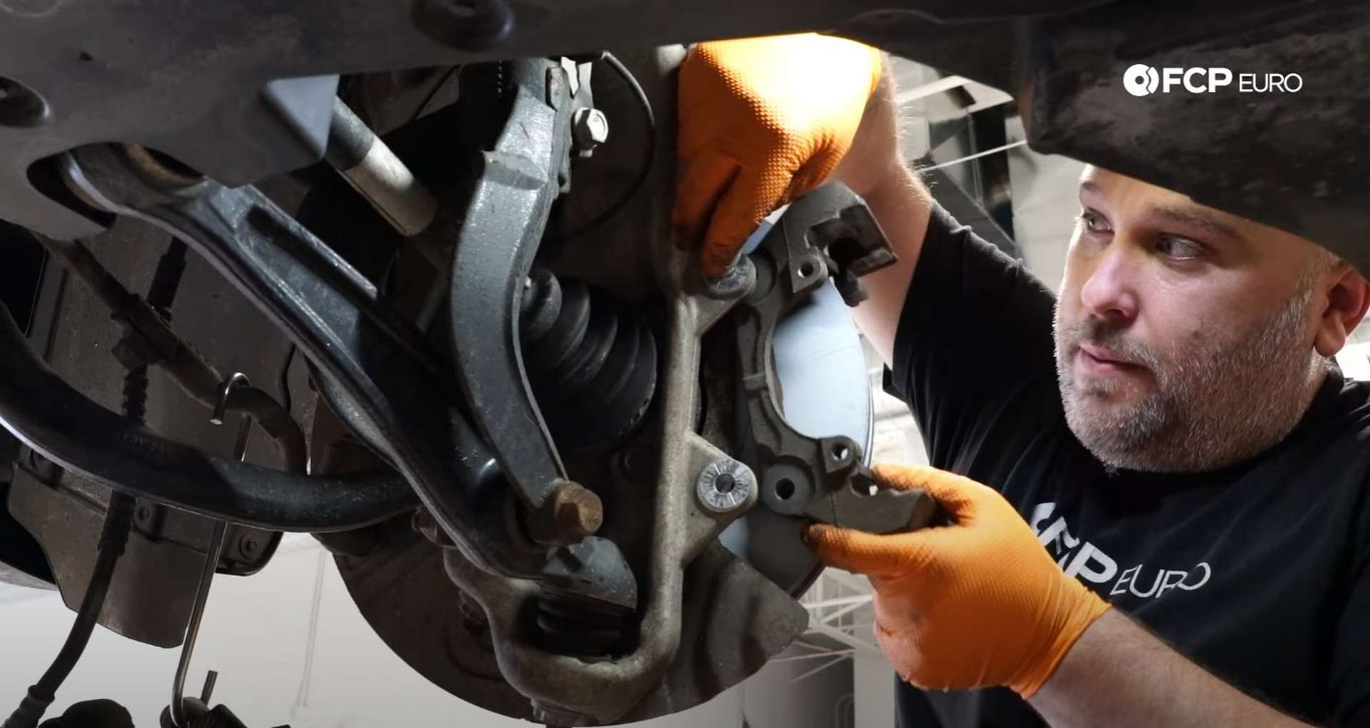 DIY BMW F15 X5 F16 X6 Brake Service reinstalling the caliper bracket