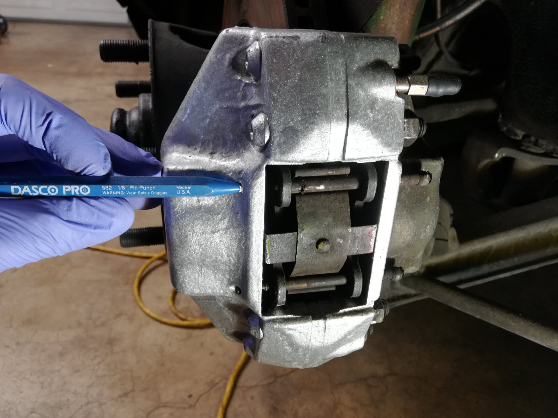 Air-cooled Porsche 911 brake pad retaining pin removal.