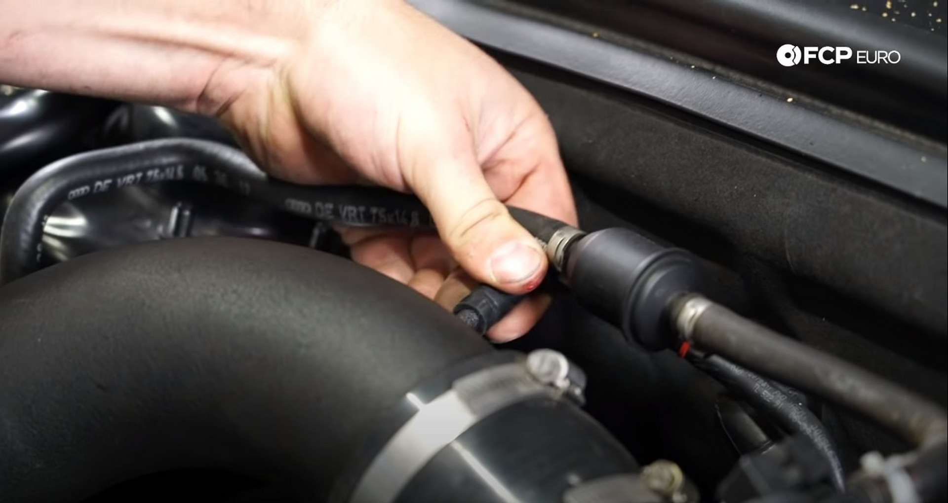 DIY Audi 3.0T Supercharger Oil Change fitting the vacuum line to the intake