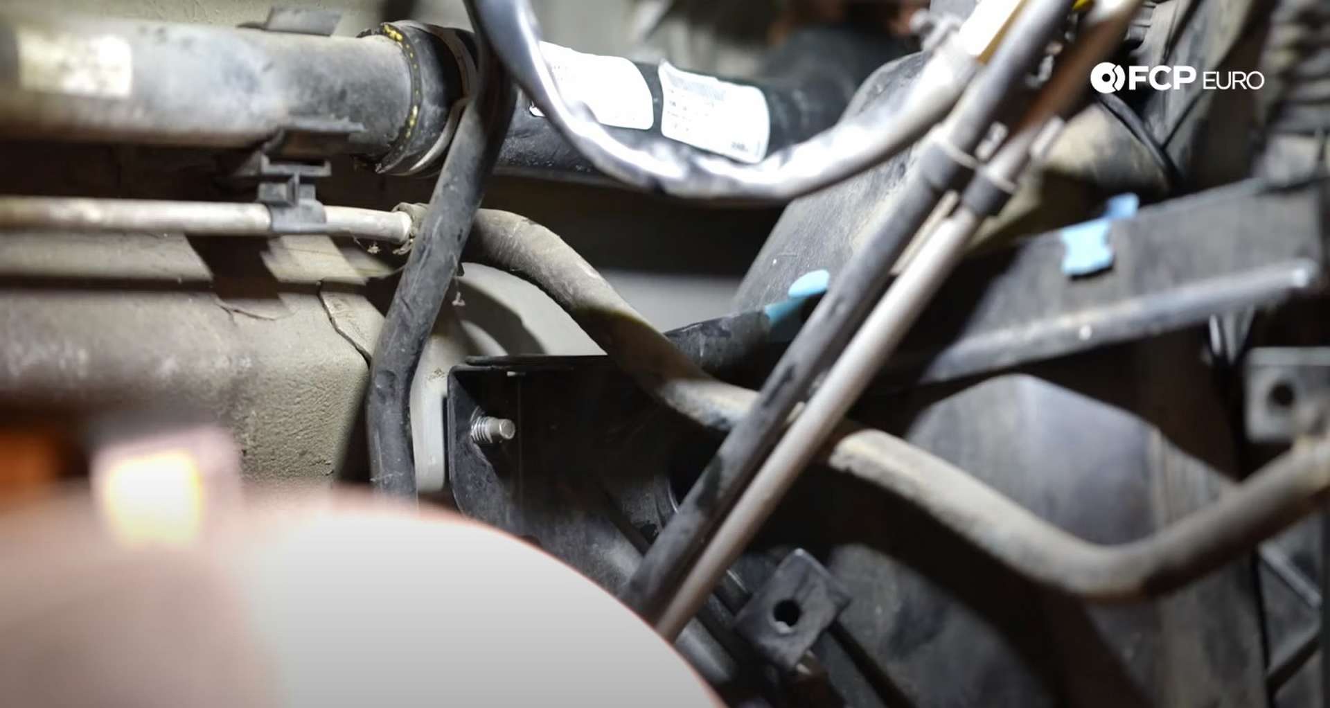 DIY Porsche 996 Radiator Replacement fan shroud bracket sitting on stud
