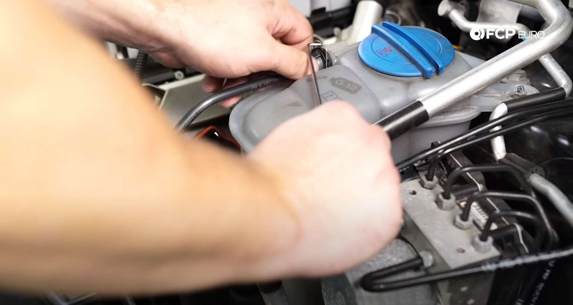DIY Audi B8.5 Water Pump and Thermostat Replacement disconnecting the coolant bleeder line